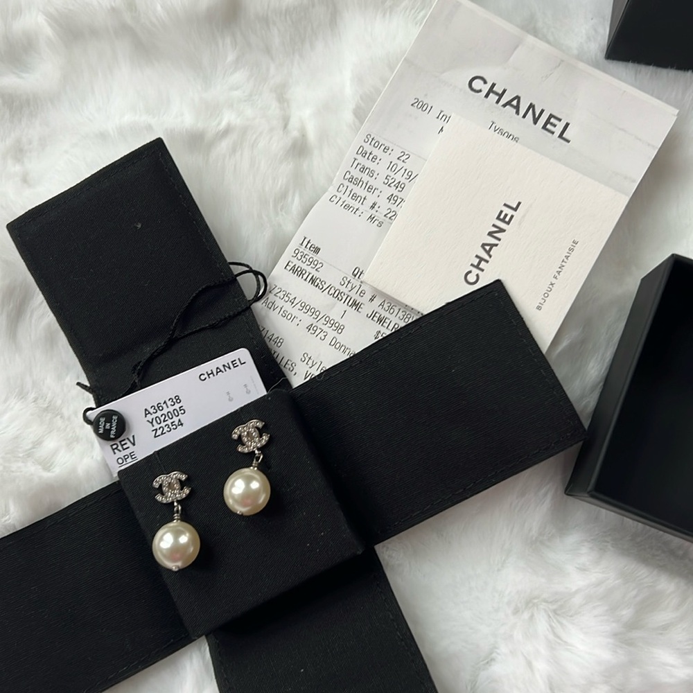 Authentic Chanel pendant pearl earrings.